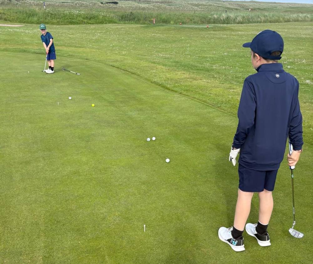 Junior Development Squad golfers practising putting at Dunes Golf Centre in Fraserburgh
