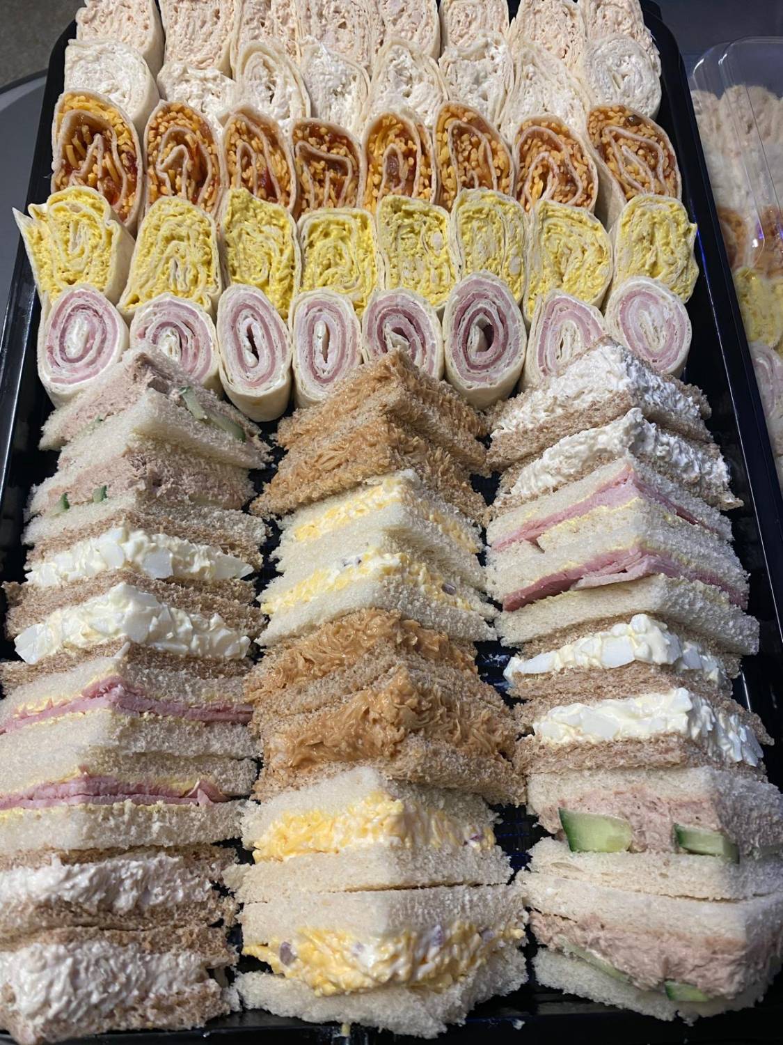 A mixed platter of mini sandwiches and wraps from Dunes Café